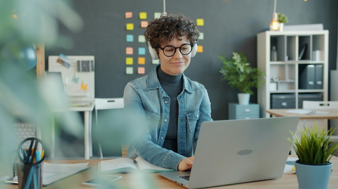 woman coding at desk