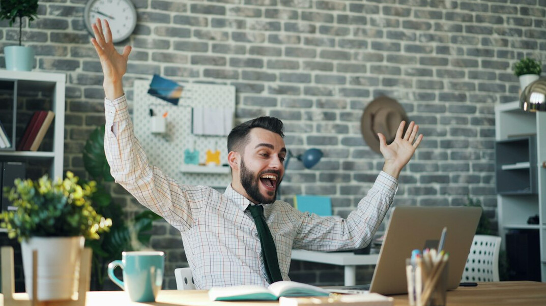 person celebrating coding success