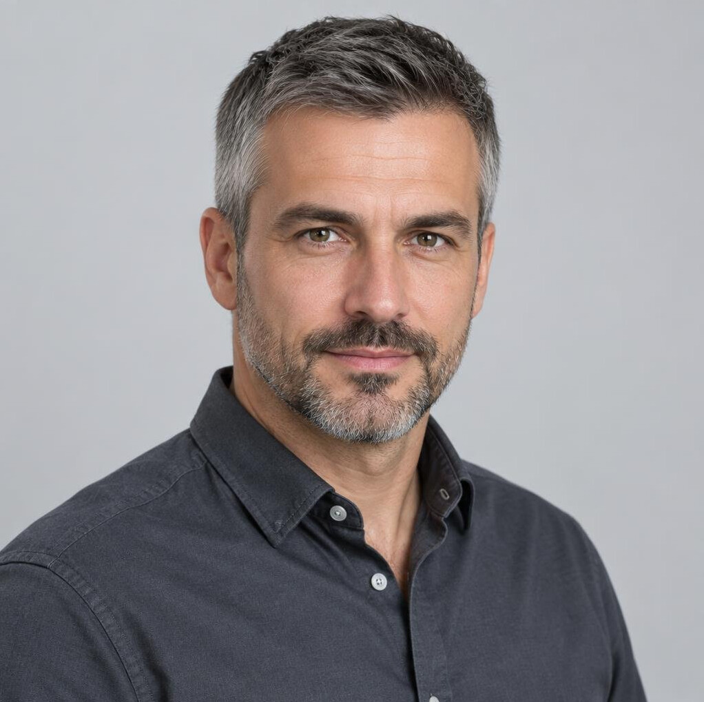 Studio portrait of a middle aged Croatian man with short grey hair
