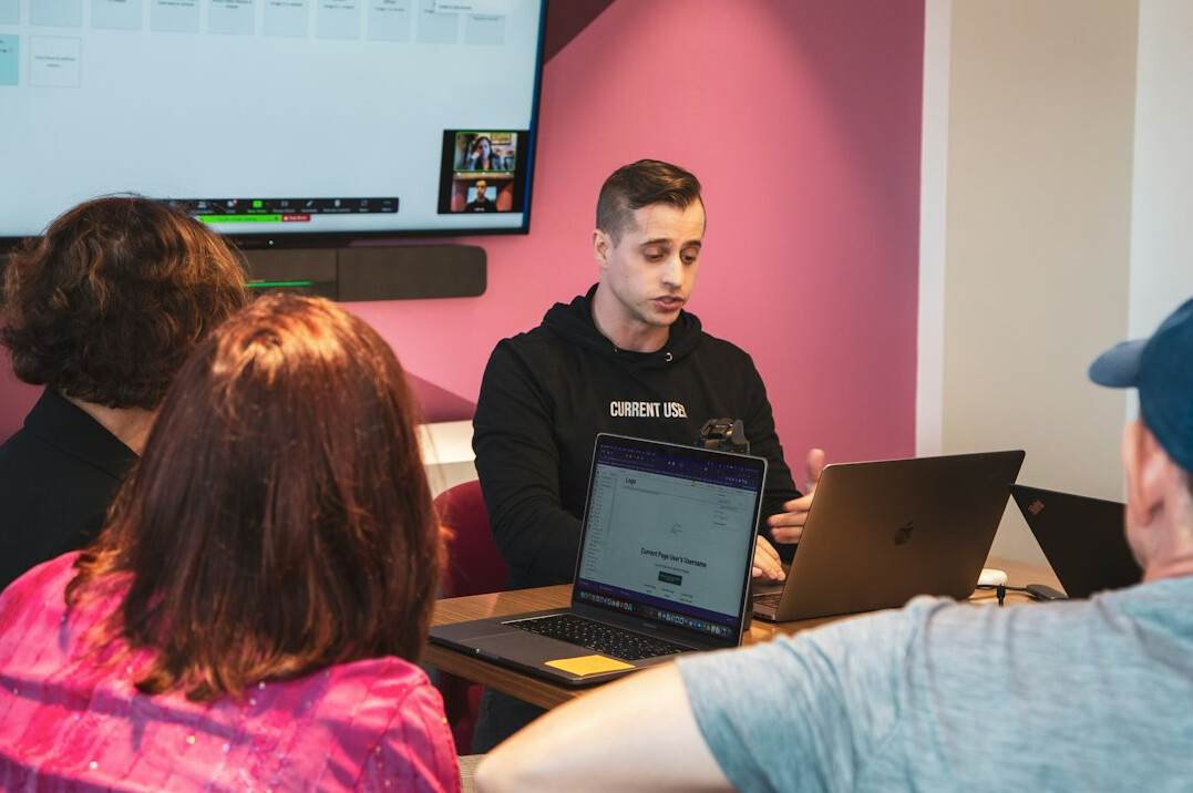 group of students coding together
